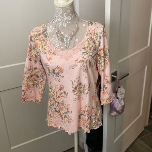 A beautiful peach top that looks great with jeans.